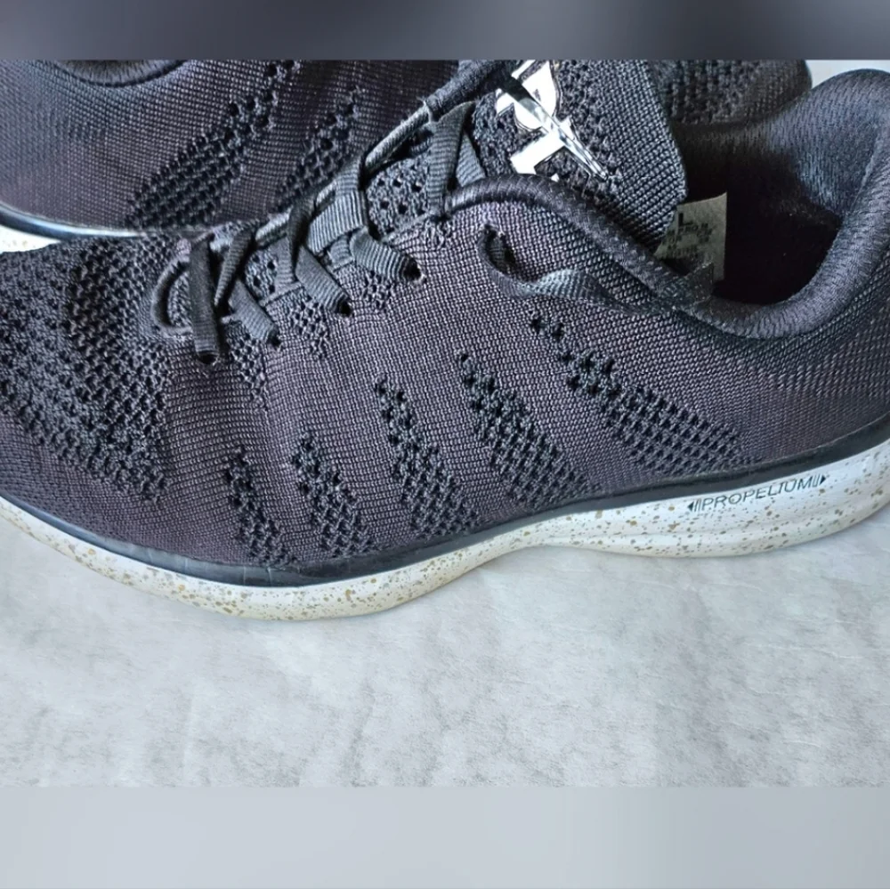 APL Techloom Pro black running shoes speckled soles